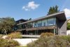 View from the garden on the living area, over the pond Photo 3 of Black Pearl modern home
