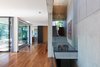 View toward the entrance door and the kitchen Photo 8 of Black Pearl modern home
