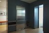 A pocket door separates the kitchen from a laundry room and access to a back stair and utility area. Photo 12 of Golden Gate Park Residence modern home