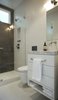 Guest bath/powder room walls and floors are white recycled ceramic tile. Back wall of shower is textured marble (detail below). Photo 18 of Golden Gate Park Residence modern home