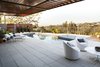 The outdoor furniture is a combination of Room and Board Oasis Collection and Knoll 1966 Line using Sunbrella Photo of Adelaide House modern home