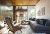 Moroccan shag area rug, custom made sectional sofa with Calvin Klein home fabric, 1950's Scandinavian Teak Lounge Easy Chair from Amsterdam Modern and decorative pillows from Calypso Home. Photo 3 of Adelaide House modern home