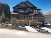 Modern home with Outdoor, Horizontal Fences, Wall, Shrubs, Trees, Hardscapes, Walkways, Retaining Fences, Wall, Front Yard, Wood Fences, Wall, Concrete Fences, Wall, and Slope. Front yard planting, wide view from the street Photo 2 of Port Moody Makeover
