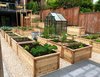 Modern home with Outdoor, Back Yard, Vegetables, Stone Patio, Porch, Deck, and Raised Planters. Back yard, overlooking the raised planters vegetable garden with a view towards the house Photo 9 of Port Moody Makeover