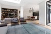 Modern home with Living Room, Medium Hardwood Floor, Sofa, Coffee Tables, Ceiling Lighting, and Pendant Lighting. Media room snug downstairs Photo 3 of Regent's Park Townhouse