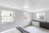 Modern home with Bedroom, Bed, Ceiling Lighting, and Medium Hardwood Floor. Motorised TV lift in the master bedroom Photo 8 of Regent's Park Townhouse