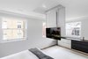Modern home with Bedroom, Bed, Ceiling Lighting, and Medium Hardwood Floor. Motorised TV lift in the master bedroom Photo 9 of Regent's Park Townhouse