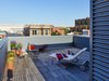 Ipe decking on the rooftop terrace with views of the National Mall. Photo of 10th Street Duplexes modern home
