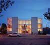 Two equal three-story units mirror each other, facing a central courtyard and providing a clear view to the neighborhood beyond. Photo of A Clear View modern home