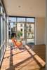 Corner-wrapping windows are open to the neighborhood. Photo 4 of A Clear View modern home