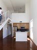 Kitchen with mezzanine above Photo 4 of Bailey Lofts modern home