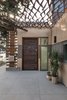 Custom copper canopy shades the exterior entry and adds a pop of color as the material oxidizes to a textured turquoise. Photo 3 of The Modern Mission modern home