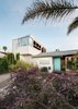The single story space shows the original shape of the home and what was upgraded in the first remodel. The two story add on created space for children's rooms and a home office with a view. Photo of The Ranch House modern home
