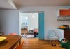 When the residents realized they were going to need more space, an addition was placed adjacent to the kitchen and dining area. Stairs lead to additional bedrooms and a second floor home office. Photo 4 of The Ranch House modern home