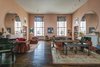The living room boasts 17' ceilings and double-height windows. Photo 5 of Longtime Home of Jacob K Javits Designed By Joseph Urban modern home