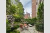 Modern home with Outdoor, Trees, Shrubs, Large Patio, Porch, Deck, Stone Patio, Porch, Deck, and Garden. The Garden Offers Peace & Relaxation Amidst The Bustle of NYC Photo 11 of Artistry & Modernity: Maisonette West