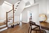 Modern home with Staircase, Wood Railing, and Wood Tread. This stunning duplex was originally two separate units combined into one gracious space. Photo of Stylish Blend in Brooklyn