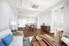 Modern home with Living Room, Sofa, Chair, Coffee Tables, Accent Lighting, and Medium Hardwood Floor. Plenty of room in this loft-like living room, dining area, and kitchen Photo 2 of Stylish Blend in Brooklyn