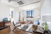Modern home with Living Room, Chair, Coffee Tables, Storage, Lamps, Accent Lighting, and Medium Hardwood Floor. The home is shrouded in light thanks to gorgeous, large windows Photo 3 of Stylish Blend in Brooklyn