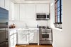 Modern home with Kitchen, Refrigerator, Wall Oven, Dishwasher, and Microwave. The kitchen offers plenty of cabinet space Photo 4 of Stylish Blend in Brooklyn