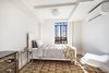 Modern home with Bedroom. Roomy bedroom with soaring city views Photo 5 of Stylish Blend in Brooklyn