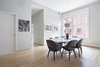 Modern home with Dining Room, Table, Ceiling Lighting, Chair, and Light Hardwood Floor. The loft-like space even boasts extra room for a formal dining area. Photo 2 of Stunning at Every Angle in Tribeca