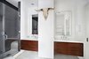 Modern home with Bath Room, Ceiling Lighting, and Enclosed Shower. The master bathroom features dual sinks, custom slate shower, radiant heated floors, heated towel rack, Toto toilet and walk-in windowed closet! Photo 5 of Stunning at Every Angle in Tribeca
