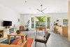 Modern home with Living Room, Sofa, Coffee Tables, and Ceiling Lighting. The open plan living room features direct access to the outside garden hidden behind private gates. Photo 2 of Wallabout Metal House