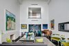 Modern home with Living Room, Bookcase, Sofa, Wood Burning Fireplace, Bench, Chair, and Floor Lighting. The living room is airy and expansive with a peek-a-boo cutout view of the second level Photo 3 of NYC Duplex with Water Views in Peter Marino-Designed Condo