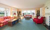 Modern home with Living Room, Chair, Shelves, Lamps, and Sofa. Bold colors and patterns make a statement throughout the home Photo 3 of Regal in Westchester