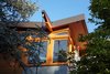 The dynamic butterfly roof and rain chains add to the modern look Photo 2 of The Gravity House modern home