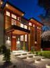 The welcoming exterior front walkway lights up at night Photo 3 of The Gravity House modern home