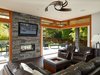 When the doors are open, the warm living room interior flows out into the garden Photo 7 of The Gravity House modern home