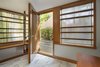 The entrance vestibule, with birch bark column and marble flooring. Photo 4 of Sustainable Urban Villa modern home