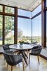 corner window view out to Boston at breakfast table Photo 17 of Boston Suburbs modern home
