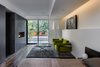 Modern home with Bedroom, Bed, Accent Lighting, Chair, Lamps, Ceiling Lighting, and Dark Hardwood Floor. Master Suite - linear fireplace w/ lava stone in sitting area - Chairs: Thayer-Coggin, designed by Milo Baughman (new), Coffee table: vintage Thayer Coggin designed by Milo Baughman (chrome and smoke glass), bed: Alias Photo 5 of Castro Residence