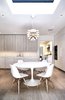 Breakfast Room - Saarinen Tulip Table, Eames side chairs, Miele appliances, Louis Poulsen PH Stainless Steel Artichoke light Photo 14 of Lyon Residence modern home