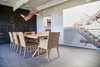 Modern home with Dining Room, Chair, Table, Ceramic Tile Floor, Accent Lighting, and Track Lighting. Dining Room - operable louvers at stair, original Jose Moya del Pino cityscape mural, Vibia Rythm light, Hermés table and chairs Photo 6 of Lyon Residence