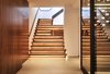 Modern home with Staircase, Wood Tread, and Wood Railing. Cascading Walnut Stairs w/ LED lights Photo 13 of Lyon Residence