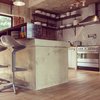 Concrete counter top and openness of the kitchen make social gatherings more relax and homely Photo 6 of Plantation House modern home