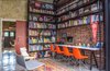 The study with floor to ceiling book shelves double up as internet browsing area and home tuition Photo 8 of Plantation House modern home
