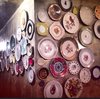 The wall of plates at the TV room is growing in numbers Photo 9 of Plantation House modern home