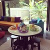 The round table in the TV room provides comfort for eating while watching what is on the tube Photo 10 of Plantation House modern home