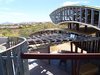 By using long span steel beams and open web bar joists, we were able to create dramatic wide open spaces that have multiple stepped levels to allow indirect light. Photo 11 of Scottsdale Desert Home modern home