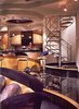 Stainless Steel Spiral Stair, stone treads & leather bottoms. Photo 4 of Biltmore Deluxe Cabana modern home