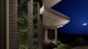 Modern home with Exterior, Mid-Century Building Type, and House Building Type. New Contemporary home main entry living plant wall and stone columns. Photo 6 of New contemporary home design in Arizona