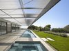 There was a solution to make a very compact plan stacked to the north of the property – to cut off the angle to below and create an all glass façade to the south. Photo 4 of Double Stick modern home
