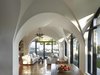 Work included the interior renovation of the family room, restoring the ceiling archways and demolishing its north facing wall for a new entry way. Photo 4 of Morgan Phoa Library and Residence modern home