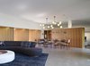 An open floor plan with the living, dining, parlor and kitchen laid out along a curve with the master suite turning the corner creates a sense of intimacy within the relatively generous accommodations. Photo 4 of Ziering Residence modern home