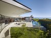A deep overhang offers an interstitial covered area for al fresco living. Photo 6 of Ziering Residence modern home